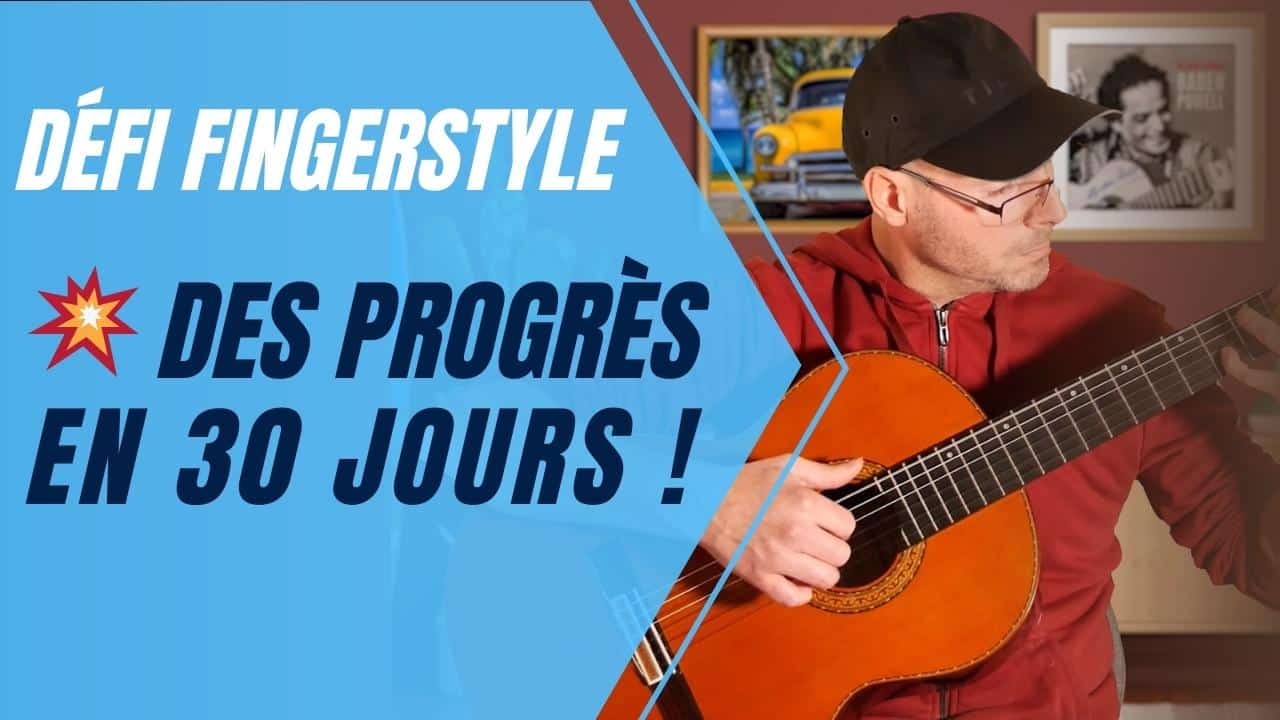 Un homme en train de jouer de la guitare fingerstyle